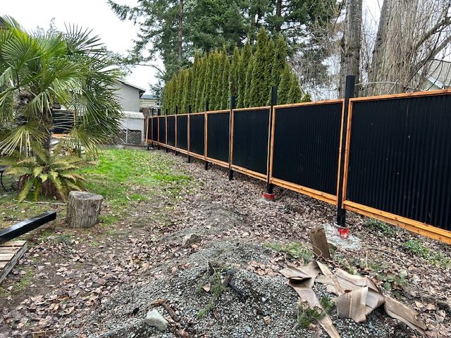 Cedar and metal panel fence